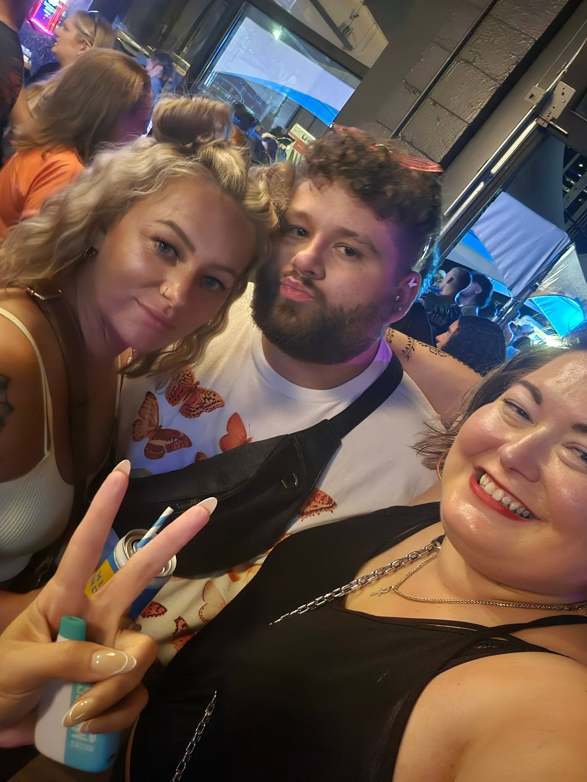 Friends sharing a group selfie at a gathering