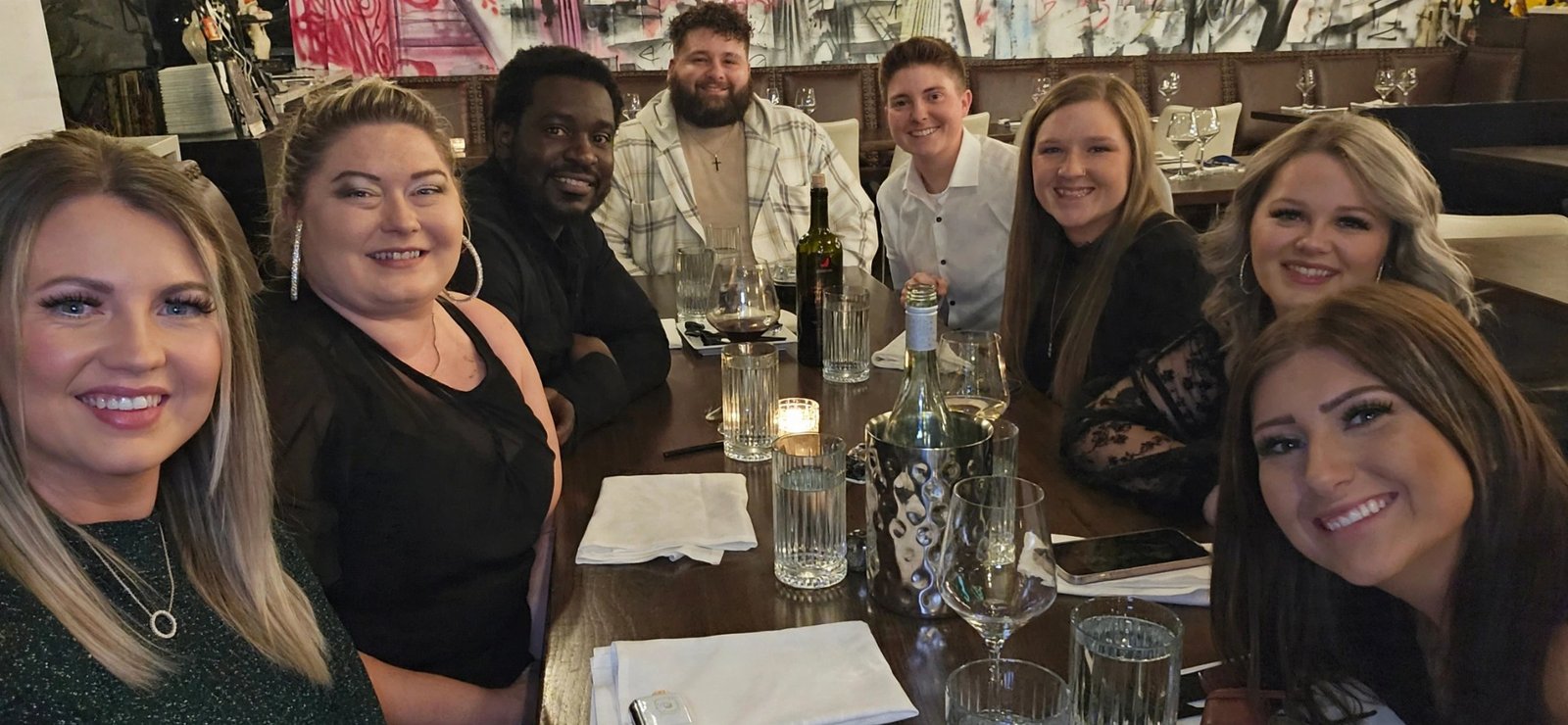 Friends gathered around a restaurant table
